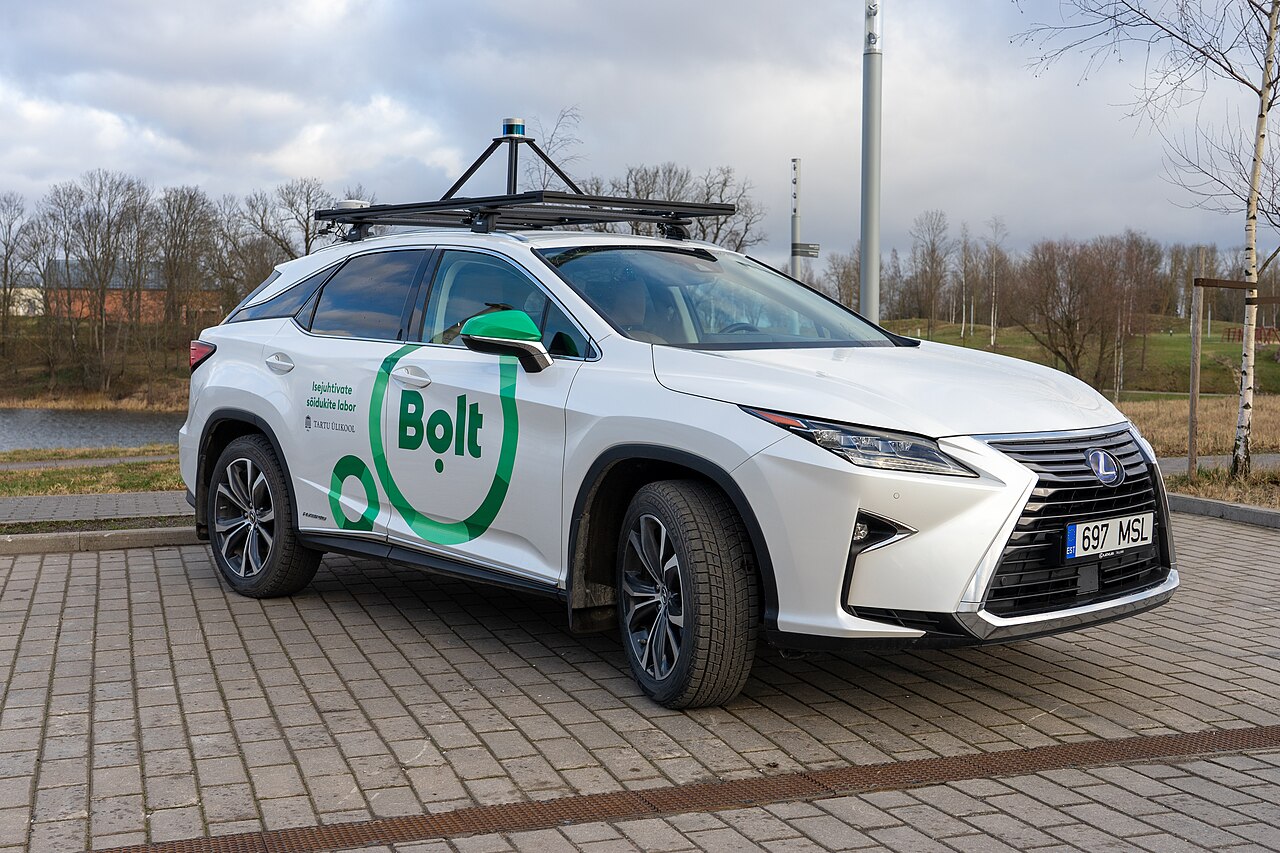 A camera-equipped autonomous test car driving on a public road