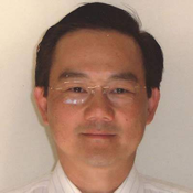 Head-and-shoulders identification photograph of Walter Liew wearing glasses