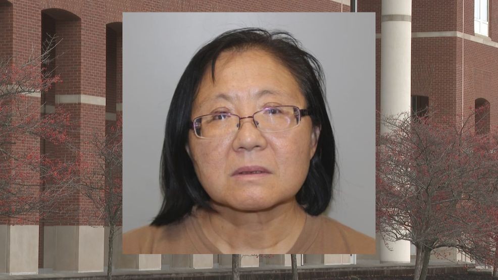 Identification photograph of Xiaorong You displayed against a federal courthouse background